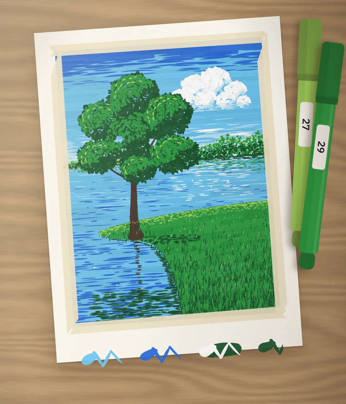 A finished painting of a tree by a lake, taped to a wooden desk, with the light green and green markers used for the crown